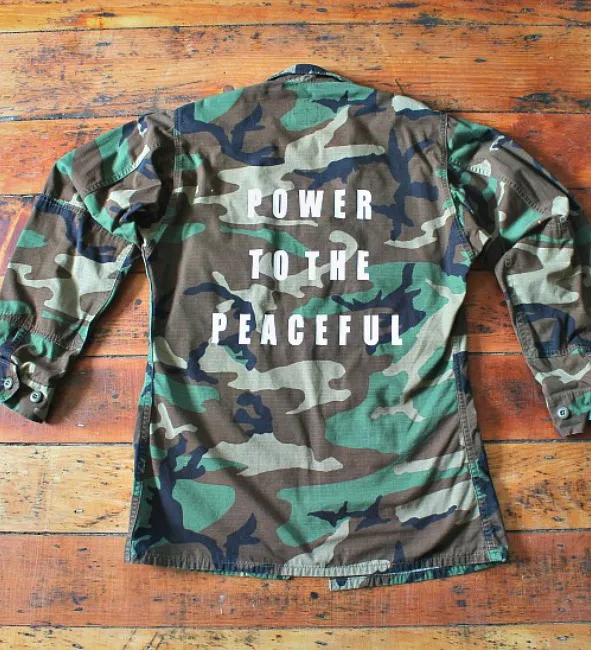 ‘Power to the peaceful’ vintage military camo jacket