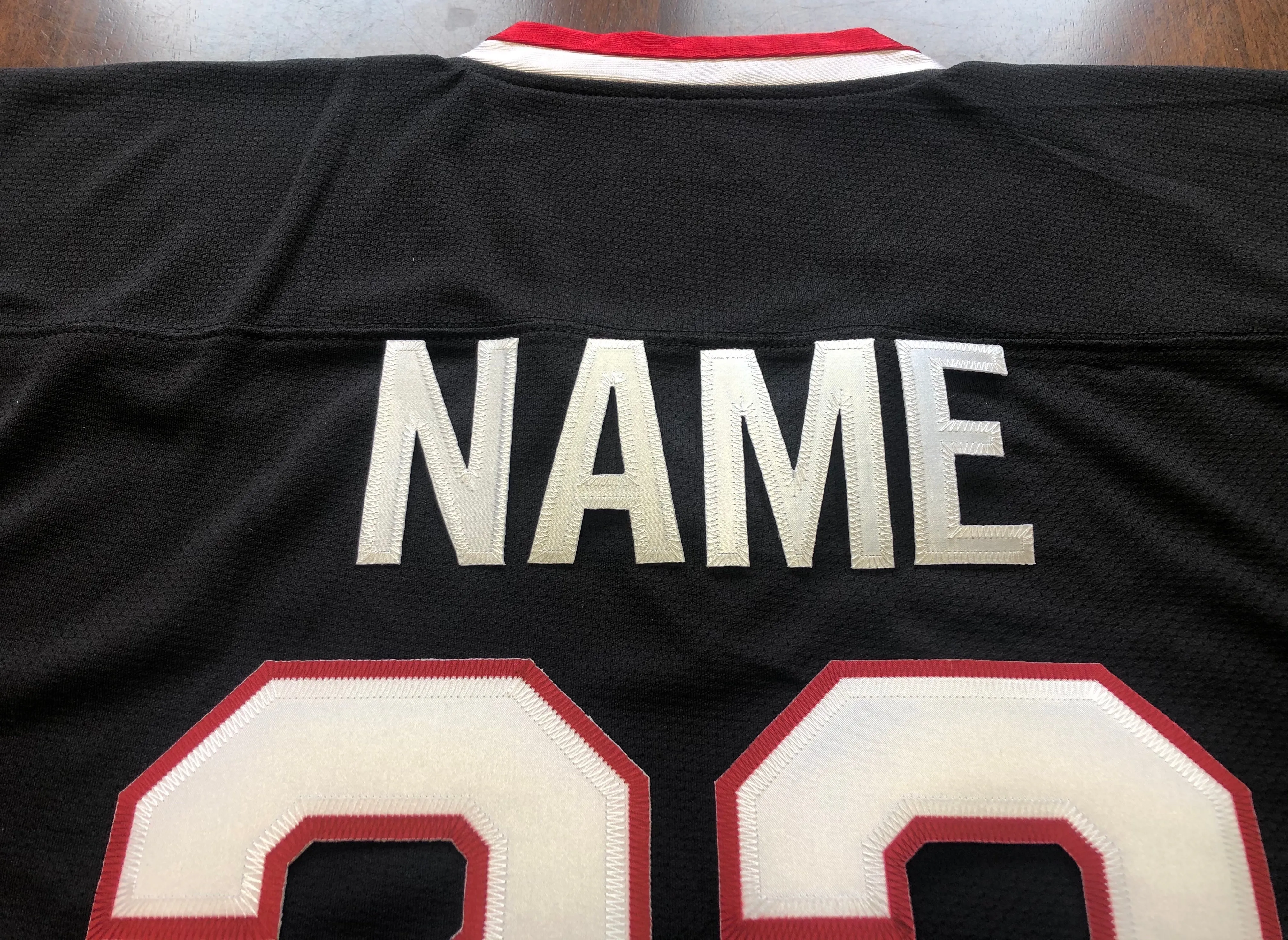 Custom Hockey Jerseys with a Blackhawk Logo and Shoulder Patches